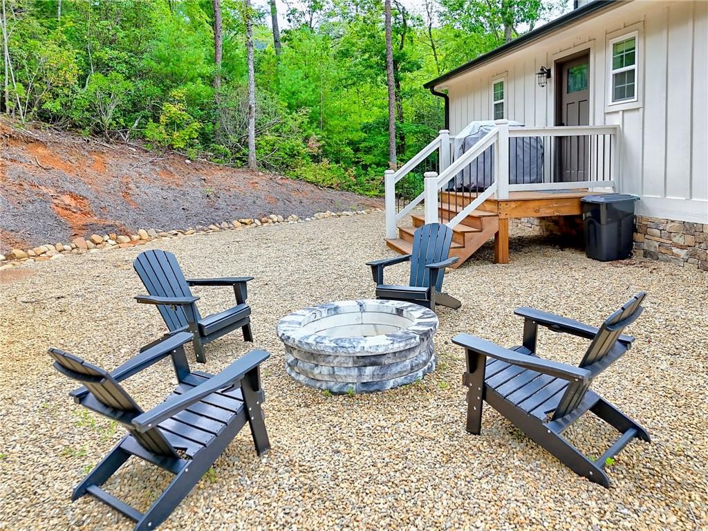 63 Redwood Lane Tiger, GA 30576 - Photo 72 of 77 a backyard of a house with table and chairs