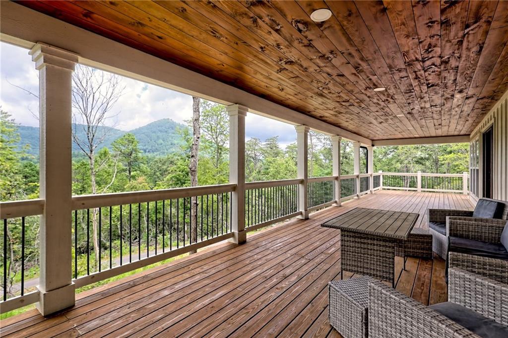 63 Redwood Lane Tiger, GA 30576 - Photo 9 of 77 a view of balcony with wooden floor and outdoor space