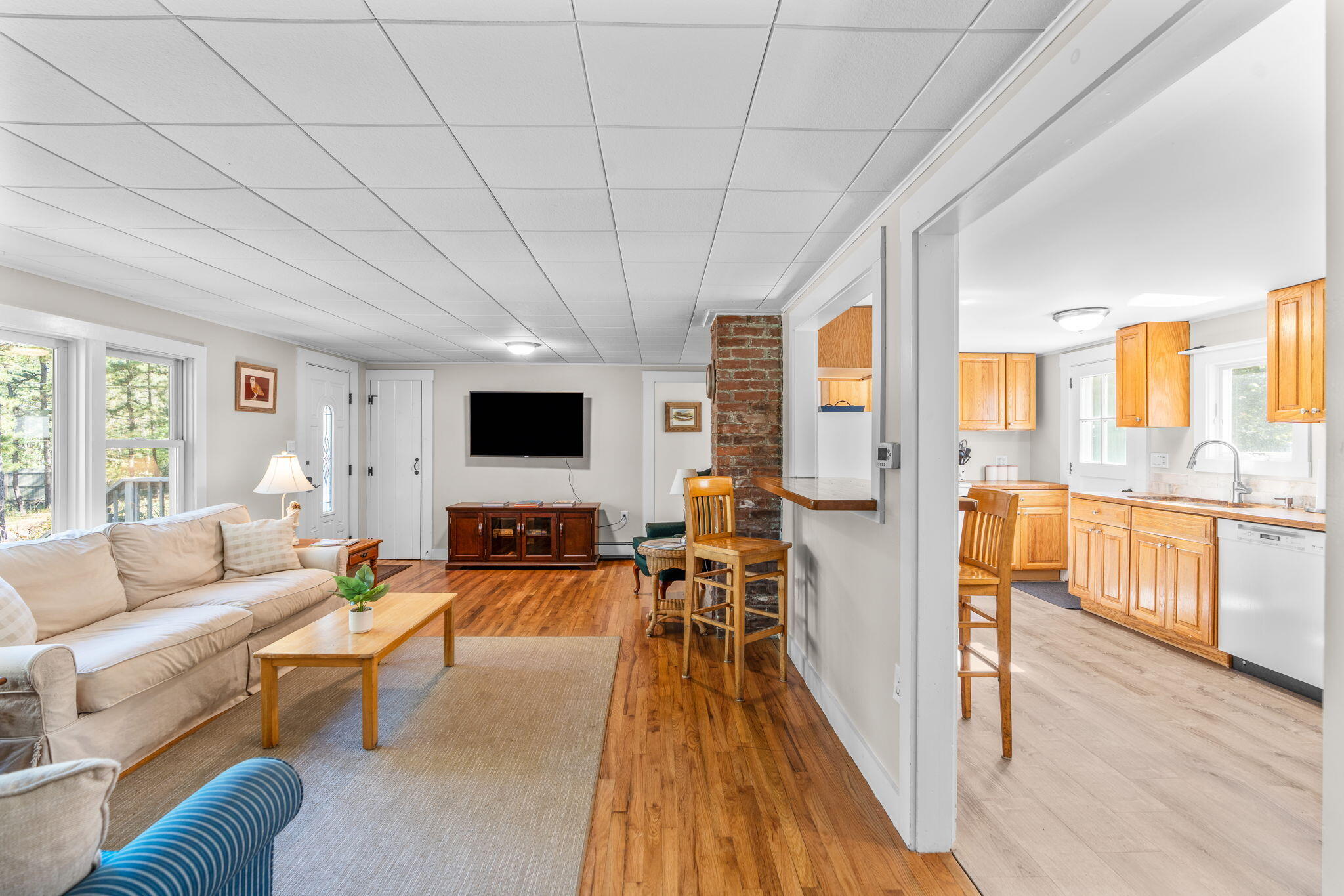 45 Indian Neck Road Wellfleet, MA 02667 - Photo 12 of 68 a living room with furniture and a flat screen tv