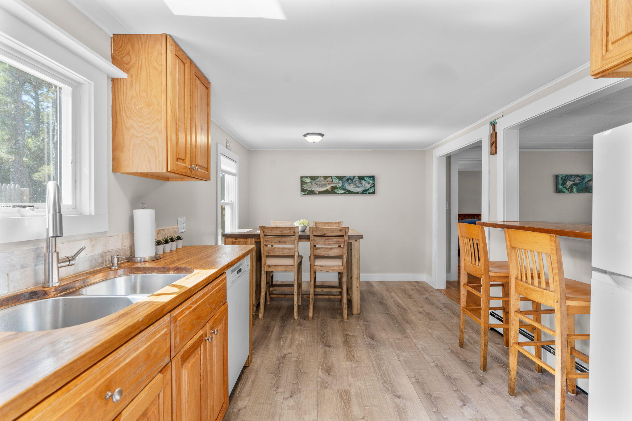 45 Indian Neck Road Wellfleet, MA 02667 - Photo 17 of 68 a kitchen with a sink a counter top space and appliances