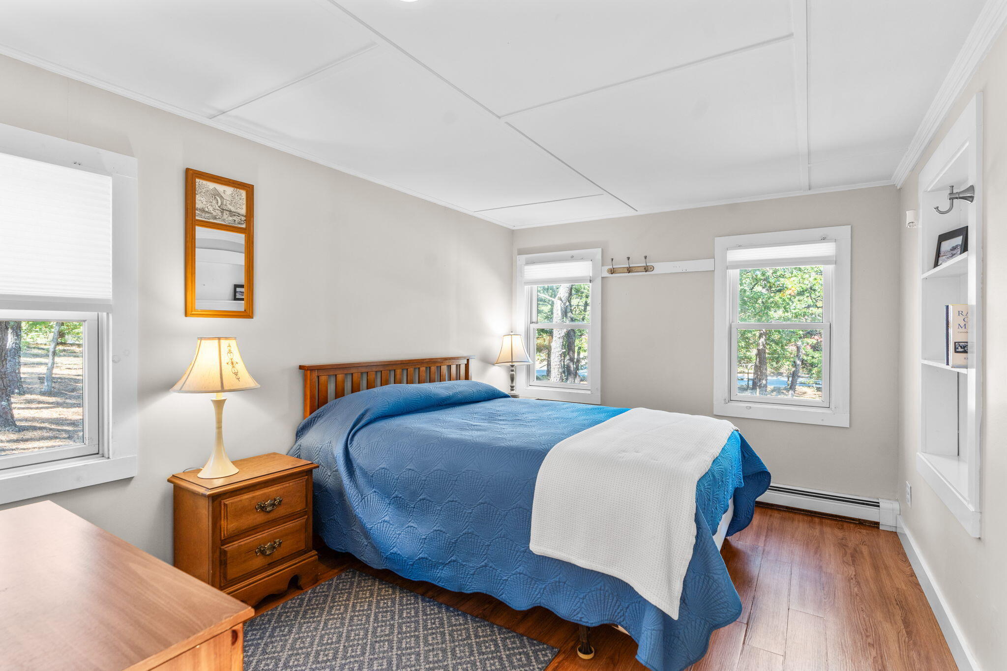 45 Indian Neck Road Wellfleet, MA 02667 - Photo 19 of 68 a bedroom with a bed and wooden floor