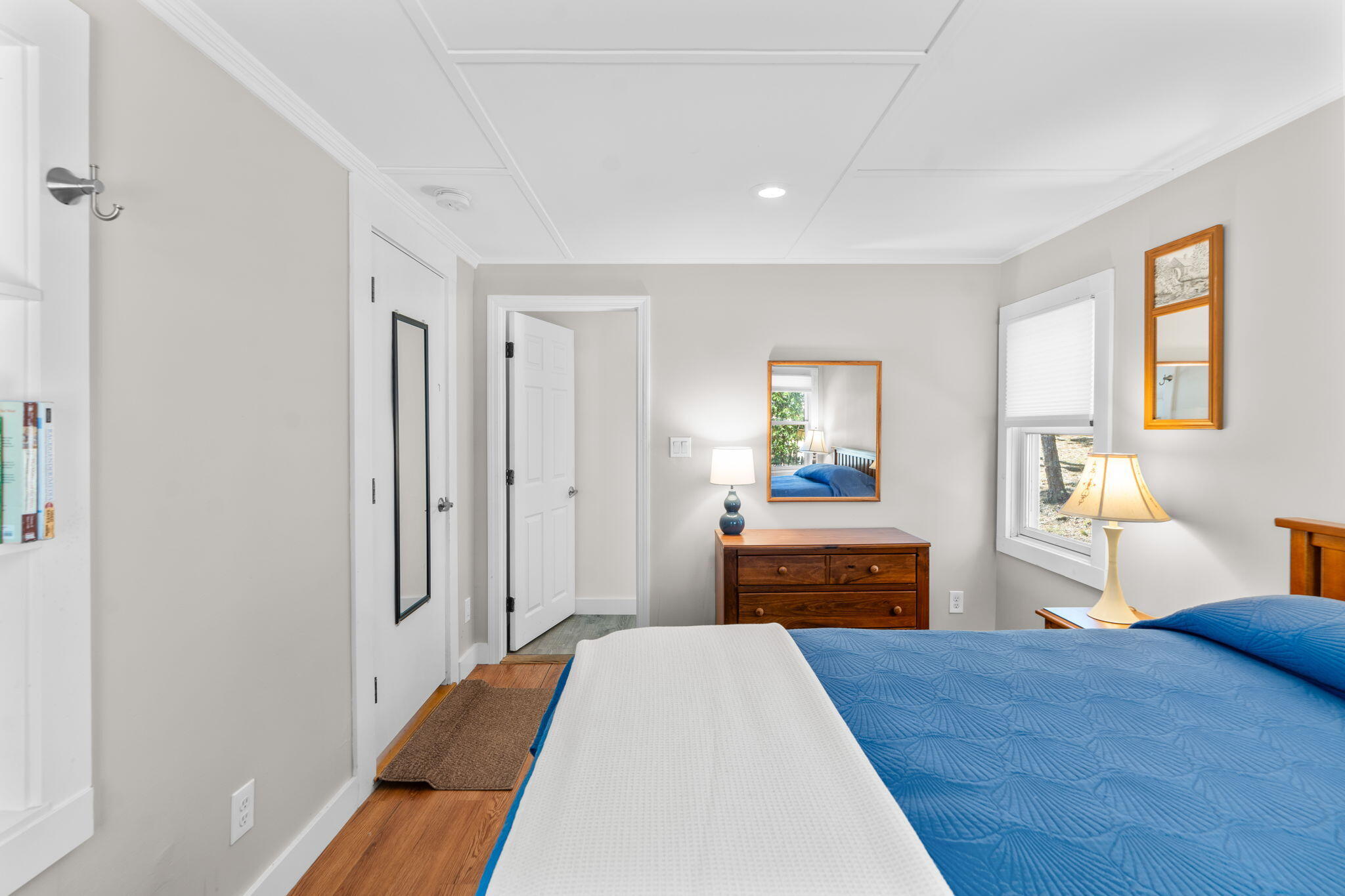 45 Indian Neck Road Wellfleet, MA 02667 - Photo 20 of 68 a bedroom with a bed and wooden floor