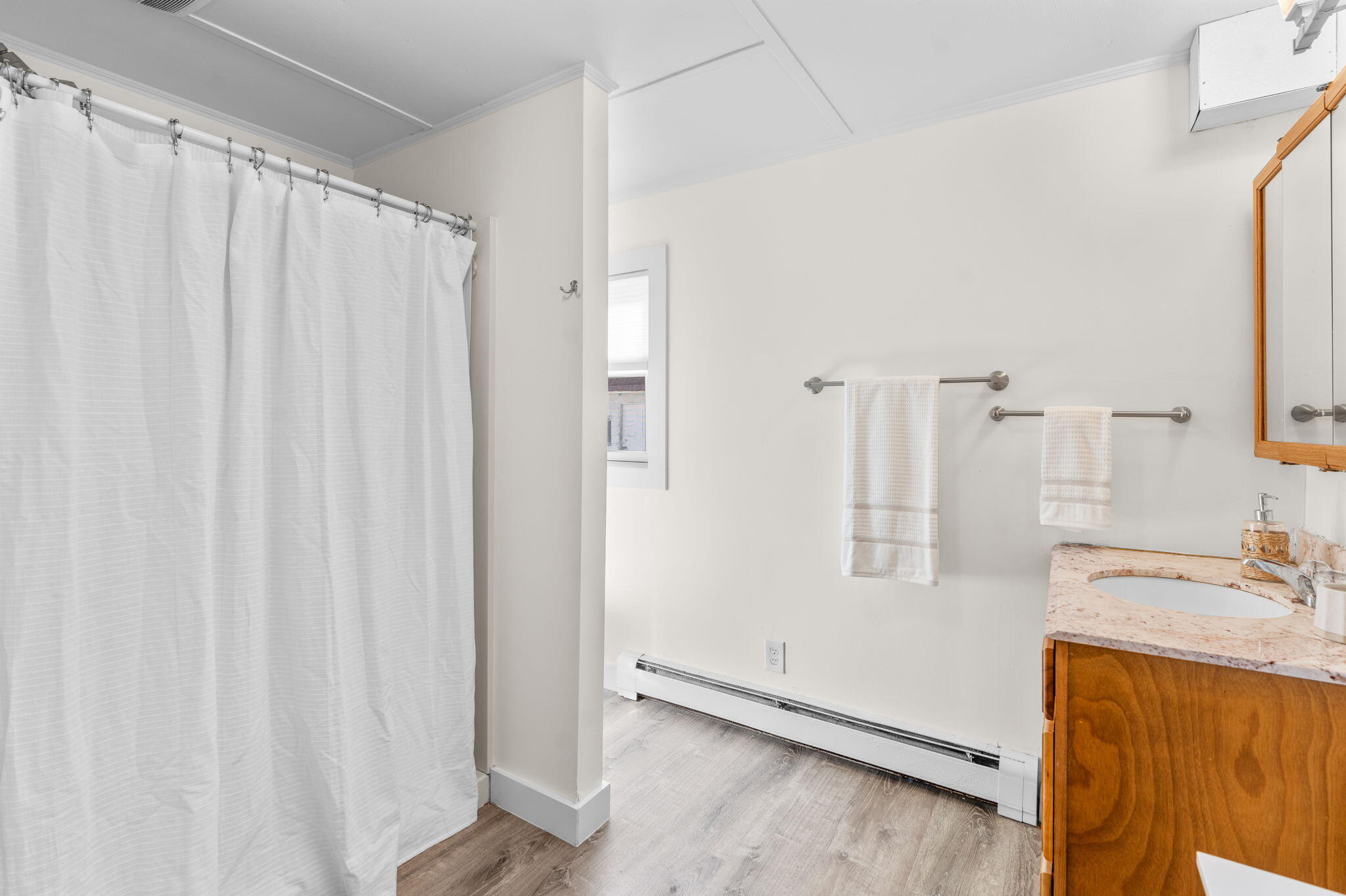 45 Indian Neck Road Wellfleet, MA 02667 - Photo 22 of 68 a bathroom with a sink and a mirror