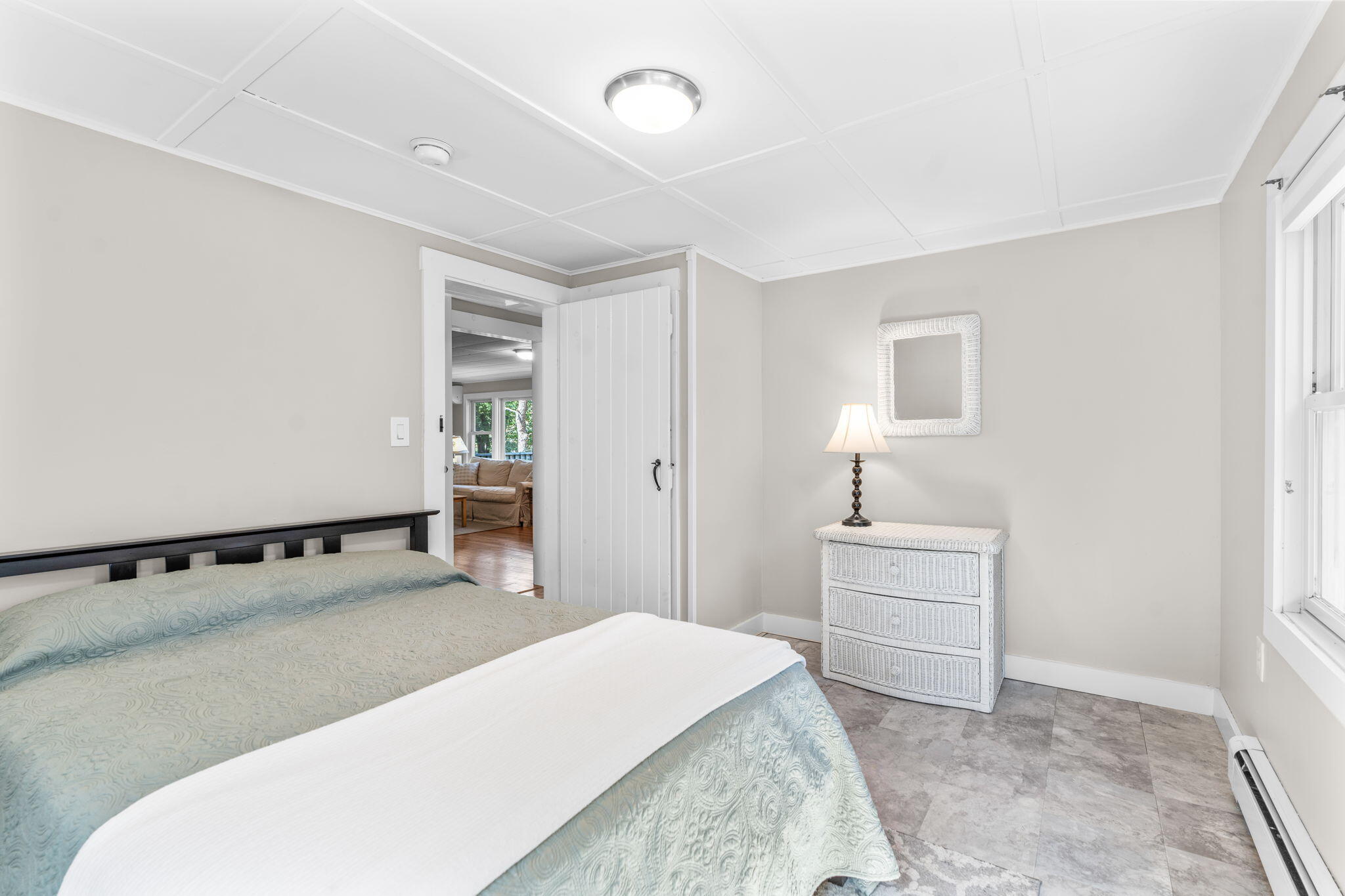 45 Indian Neck Road Wellfleet, MA 02667 - Photo 23 of 68 a bedroom with a bed and cabinets