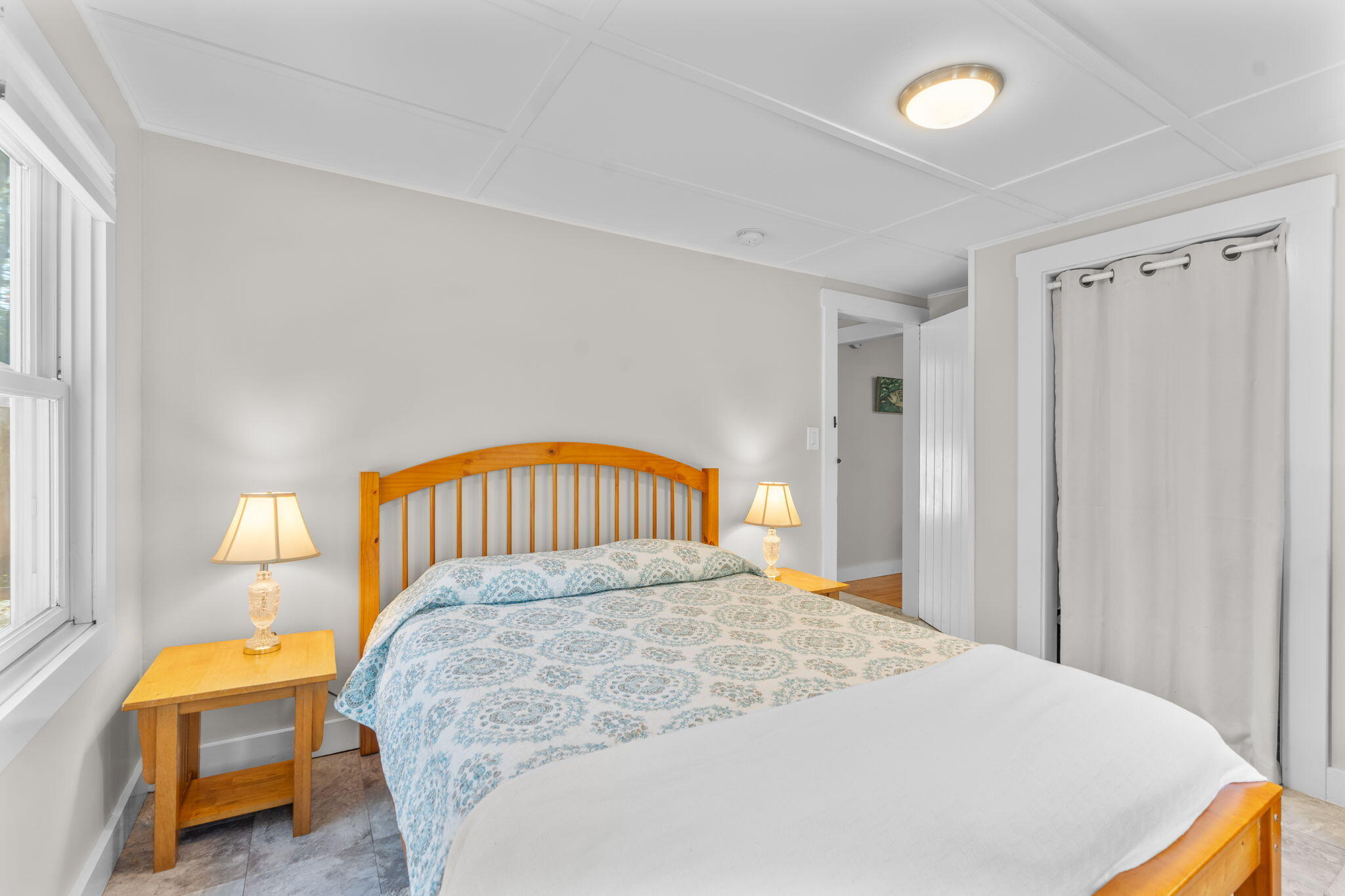 45 Indian Neck Road Wellfleet, MA 02667 - Photo 26 of 68 a bedroom with a bed and a potted plant