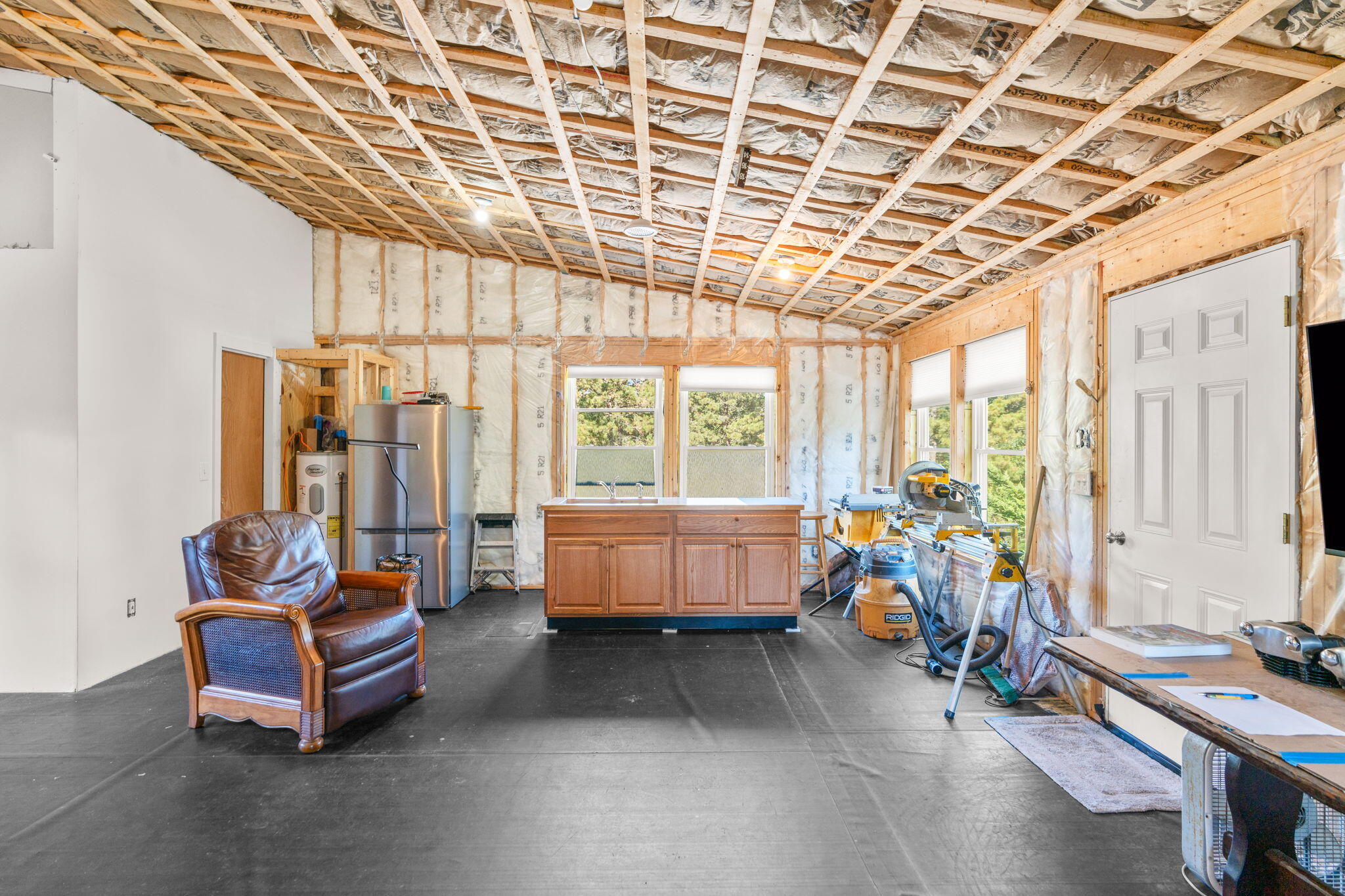 45 Indian Neck Road Wellfleet, MA 02667 - Photo 43 of 68 a living room with furniture and a large window