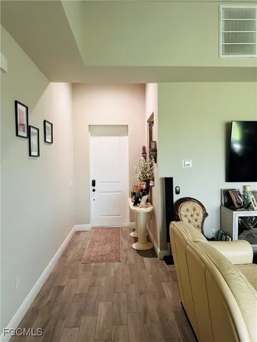 a room with furniture and a flat screen tv