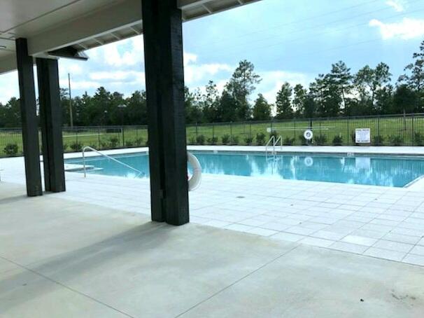 853 Otto Loop Crestview, FL 32539 - Photo 32 of 36 a view of a swimming pool with a lake view