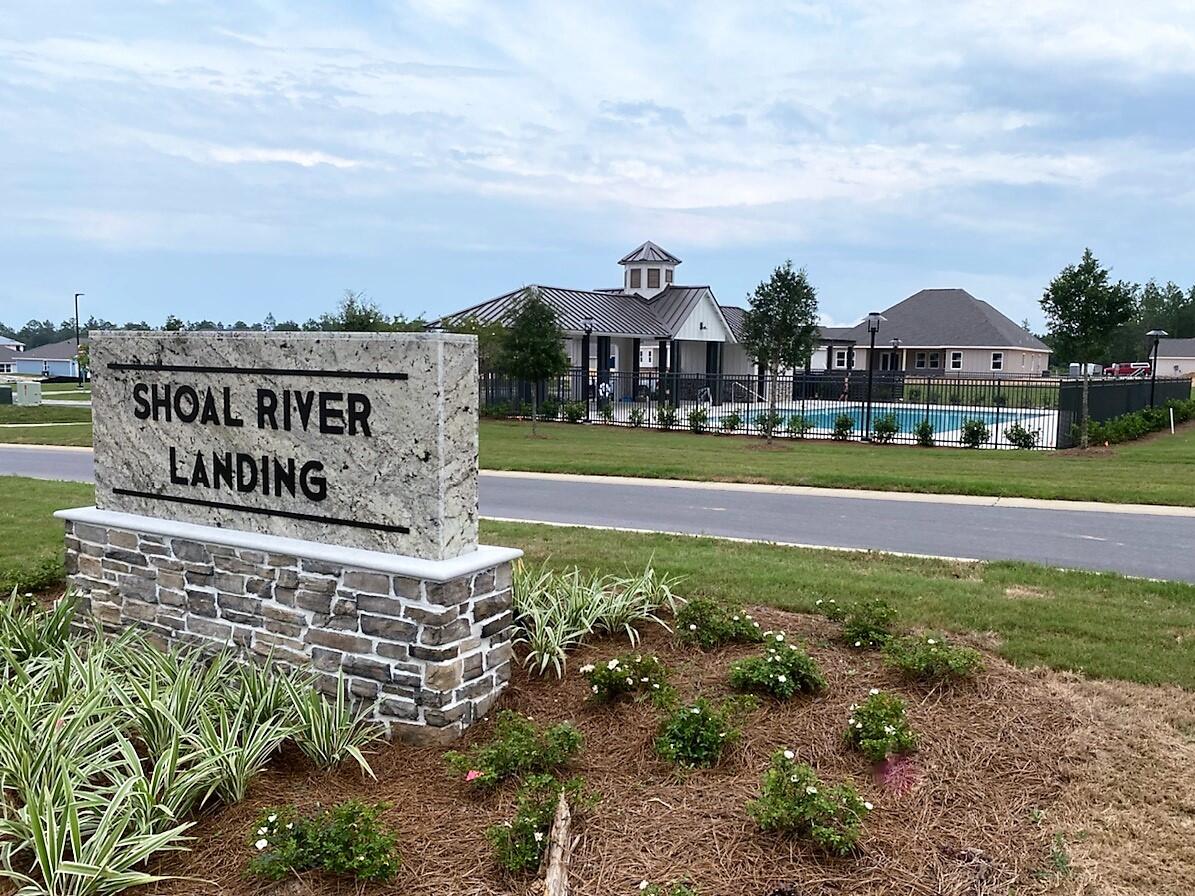 853 Otto Loop Crestview, FL 32539 - Photo 4 of 36 a view of a big building in front of a big yard with large trees
