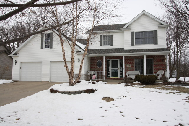 a view of a house with snow on the ground