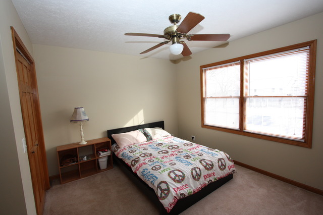 415 Rivers Edge Drive Minooka, IL 60447 - Photo 15 of 24 a bedroom with a bed and a window