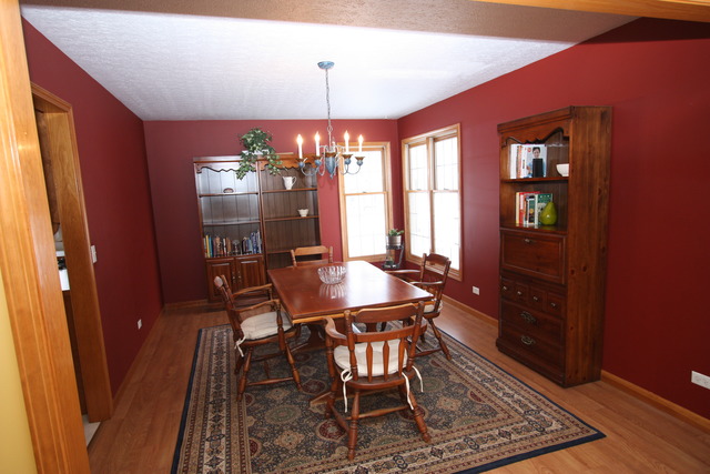 415 Rivers Edge Drive Minooka, IL 60447 - Photo 3 of 24 a view of a dining room with furniture and window