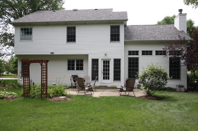 415 Rivers Edge Drive Minooka, IL 60447 - Photo 24 of 24 a house view with a garden and patio