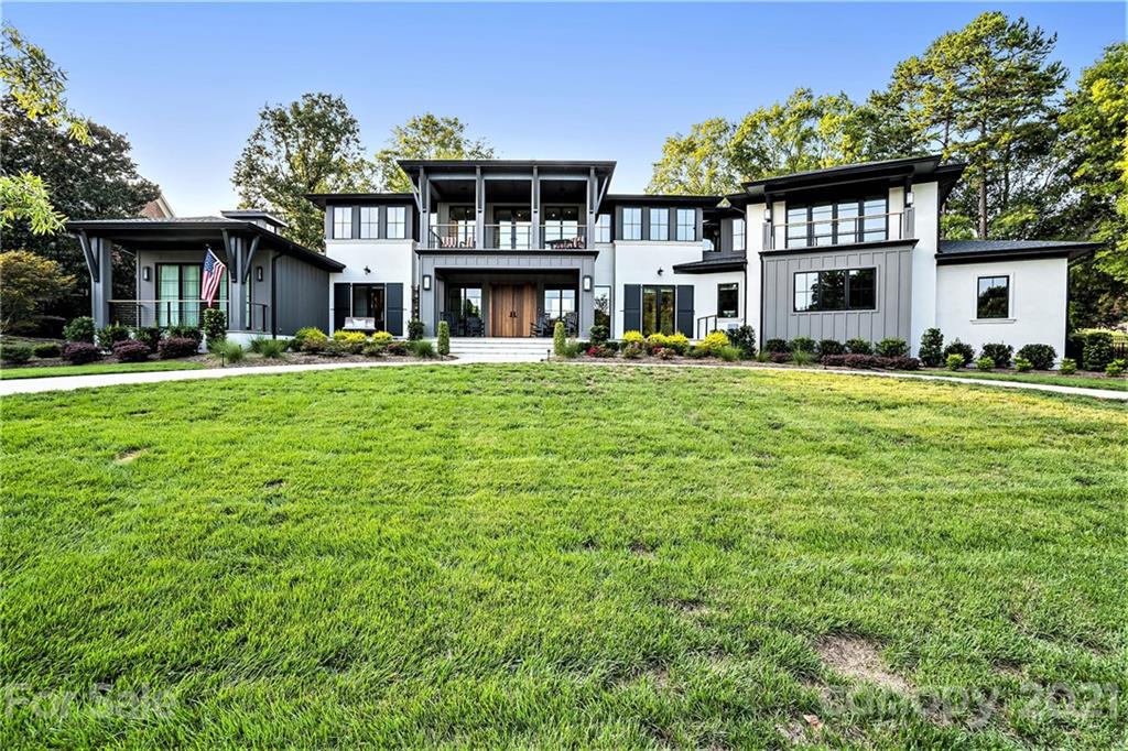 a front view of a building with a garden