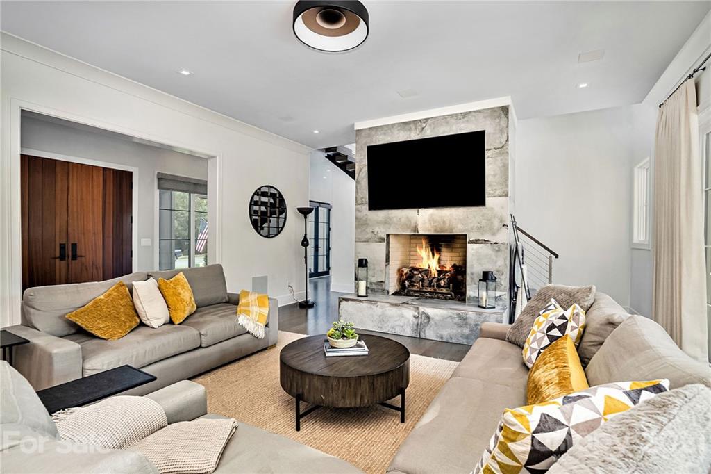 19053 Double Eagle Drive Cornelius, NC 28031 - Photo 15 of 43 a living room with furniture and a flat screen tv