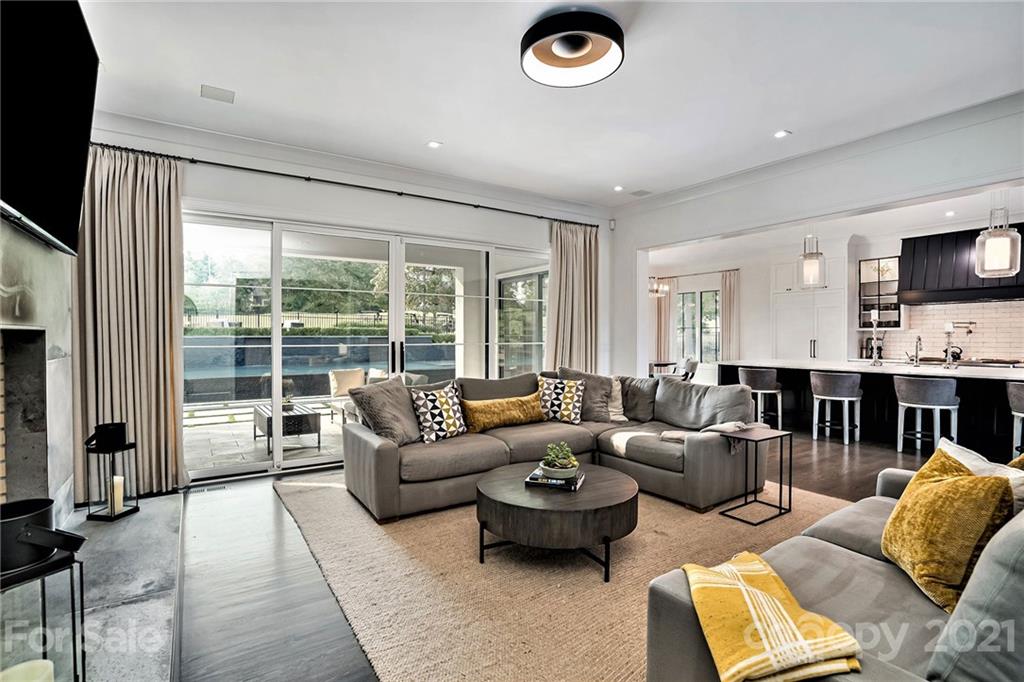 19053 Double Eagle Drive Cornelius, NC 28031 - Photo 17 of 43 a living room with furniture and a flat screen tv