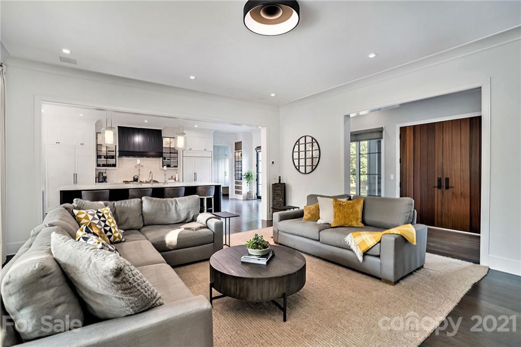 19053 Double Eagle Drive Cornelius, NC 28031 - Photo 18 of 43 a living room with furniture and a flat screen tv