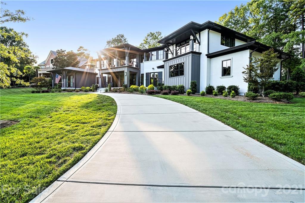 19053 Double Eagle Drive Cornelius, NC 28031 - Photo 4 of 43 a front view of a house with a yard