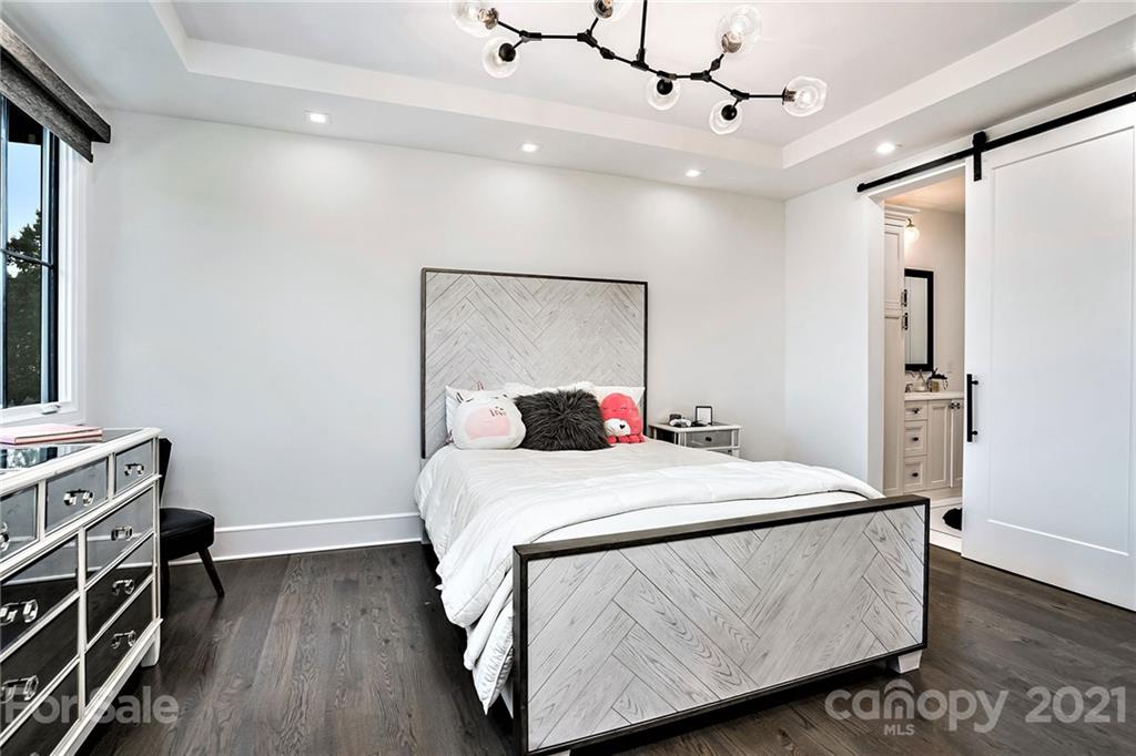 19053 Double Eagle Drive Cornelius, NC 28031 - Photo 32 of 43 a bed room with a bed and a mirror