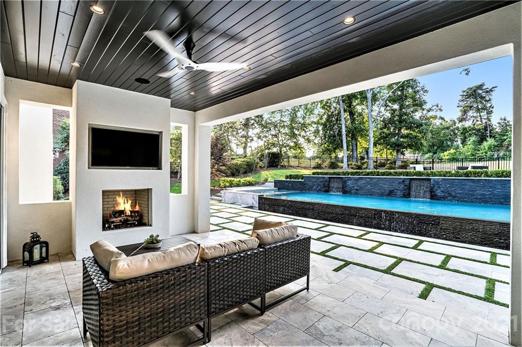 19053 Double Eagle Drive Cornelius, NC 28031 - Photo 37 of 43 a living room with furniture and a floor to ceiling window