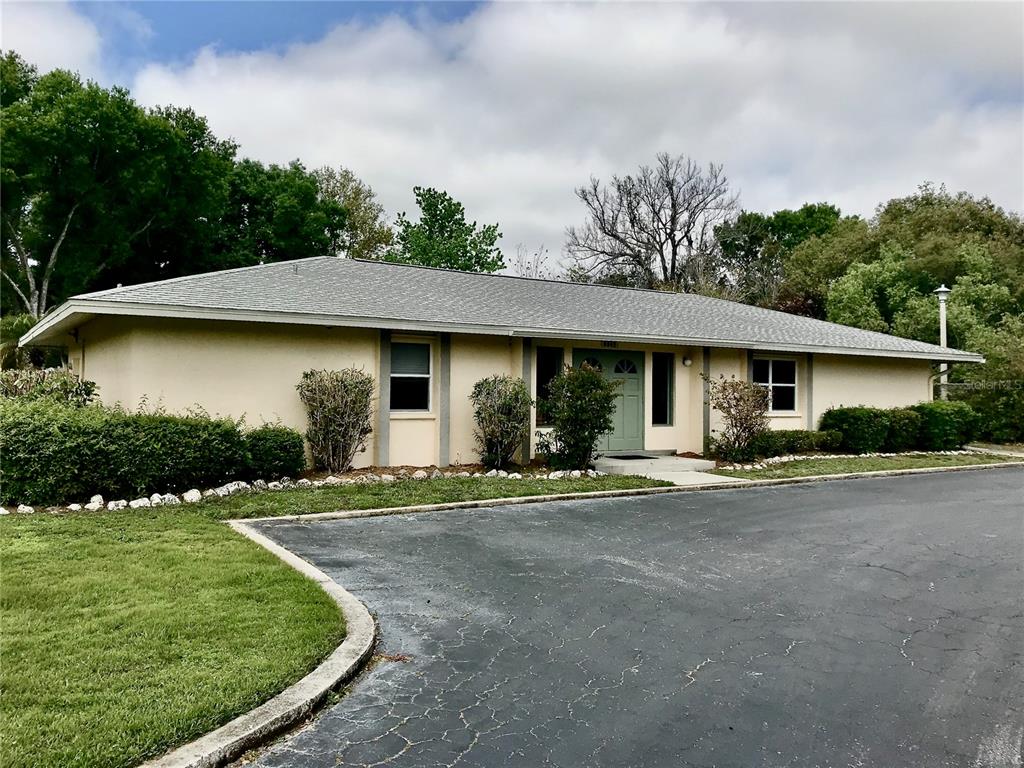 4805 Rilma Avenue, Unit 102 Sarasota, FL 34234 - Photo 17 of 18 a front view of a house with garden