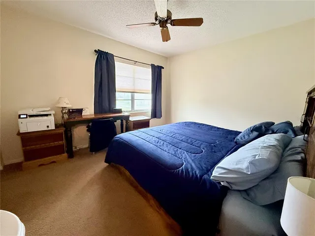 a bedroom with bed and window