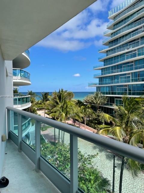 a view of balcony with furniture