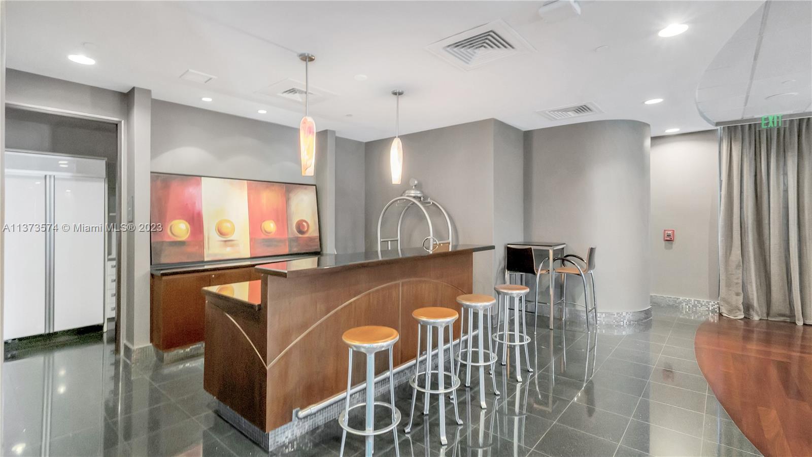 9401 Collins Avenue, Unit 402 Surfside, FL 33154 - Photo 30 of 31 a dinning room with furniture