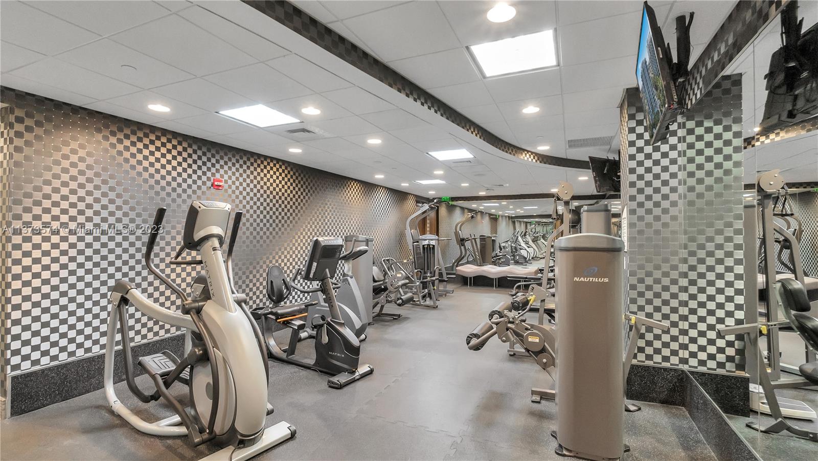 9401 Collins Avenue, Unit 402 Surfside, FL 33154 - Photo 31 of 31 a view of a room with gym equipment