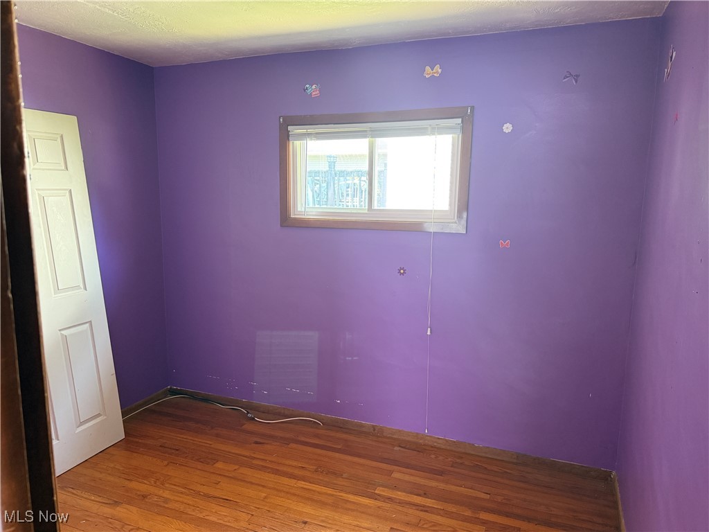 6350 Meadowbrook Road Garfield Heights, OH 44125 - Photo 26 of 28 Empty room with wood finished floors