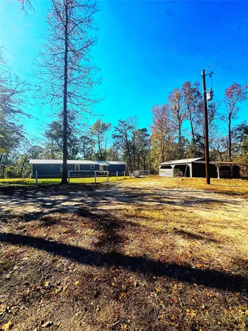 a view of a swimming pool with an outdoor space and seating area