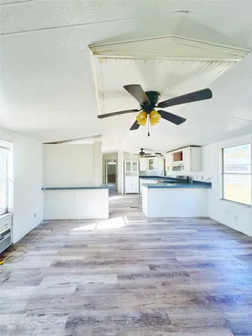 a view of a street with houses on the side