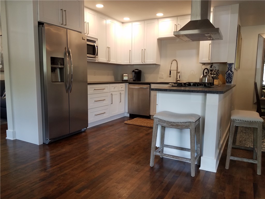 5405 Hudson Street Austin, TX 78721 - Photo 11 of 37 Culinary delights await in this modern kitchen with ample counter space and stainless appliances.