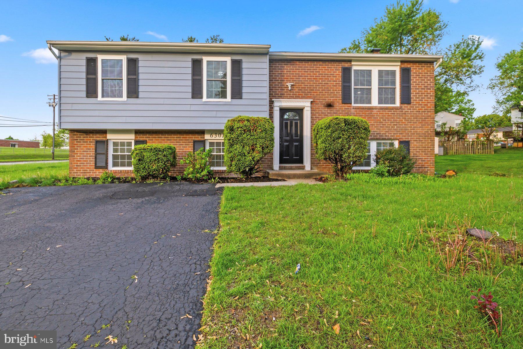 6301 Linus Drive Baltimore, MD 21207 - Photo 1 of 38 a front view of house with yard and green space
