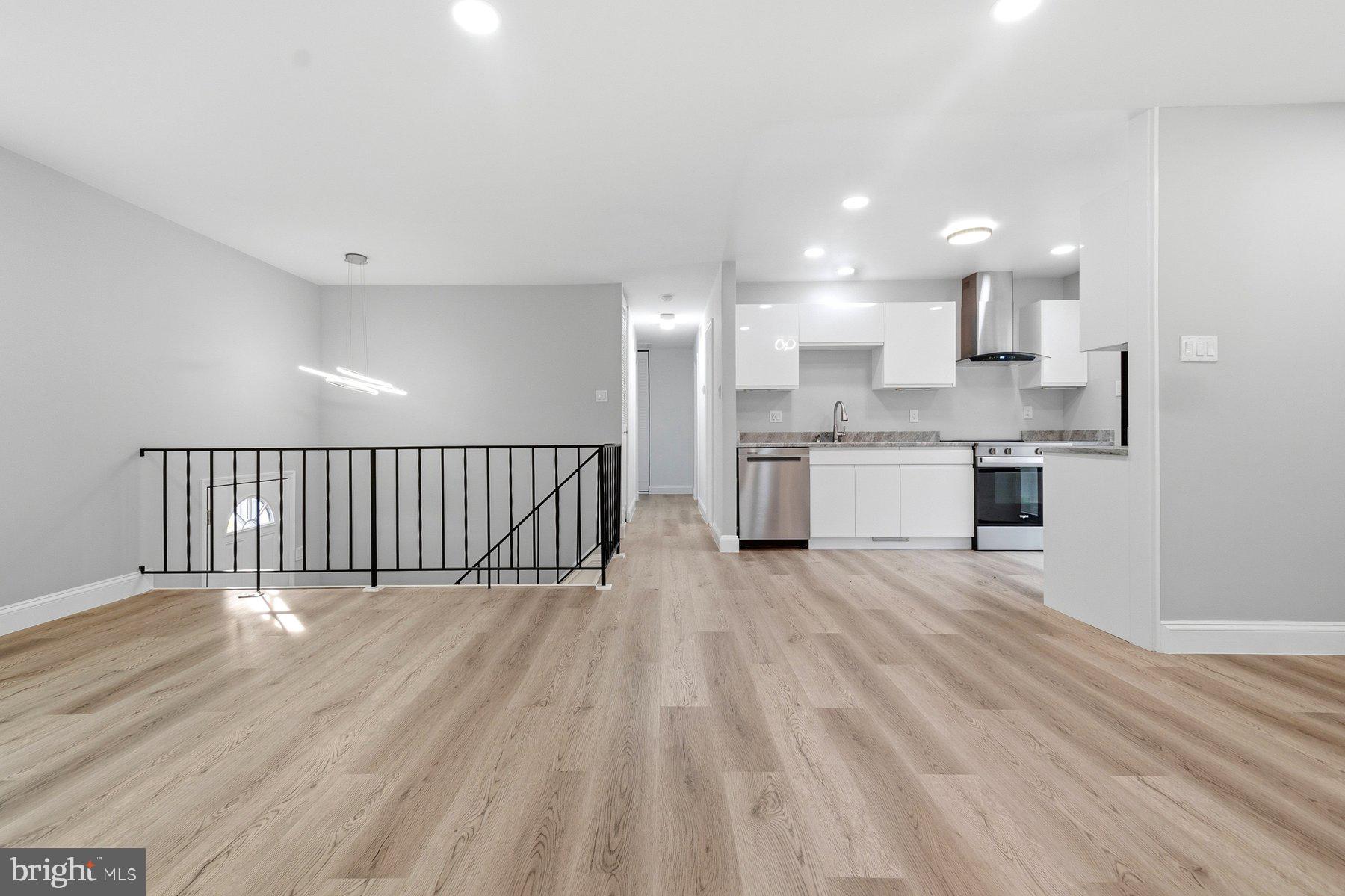 6301 Linus Drive Baltimore, MD 21207 - Photo 15 of 38 a view of a kitchen with wooden floor and a sink