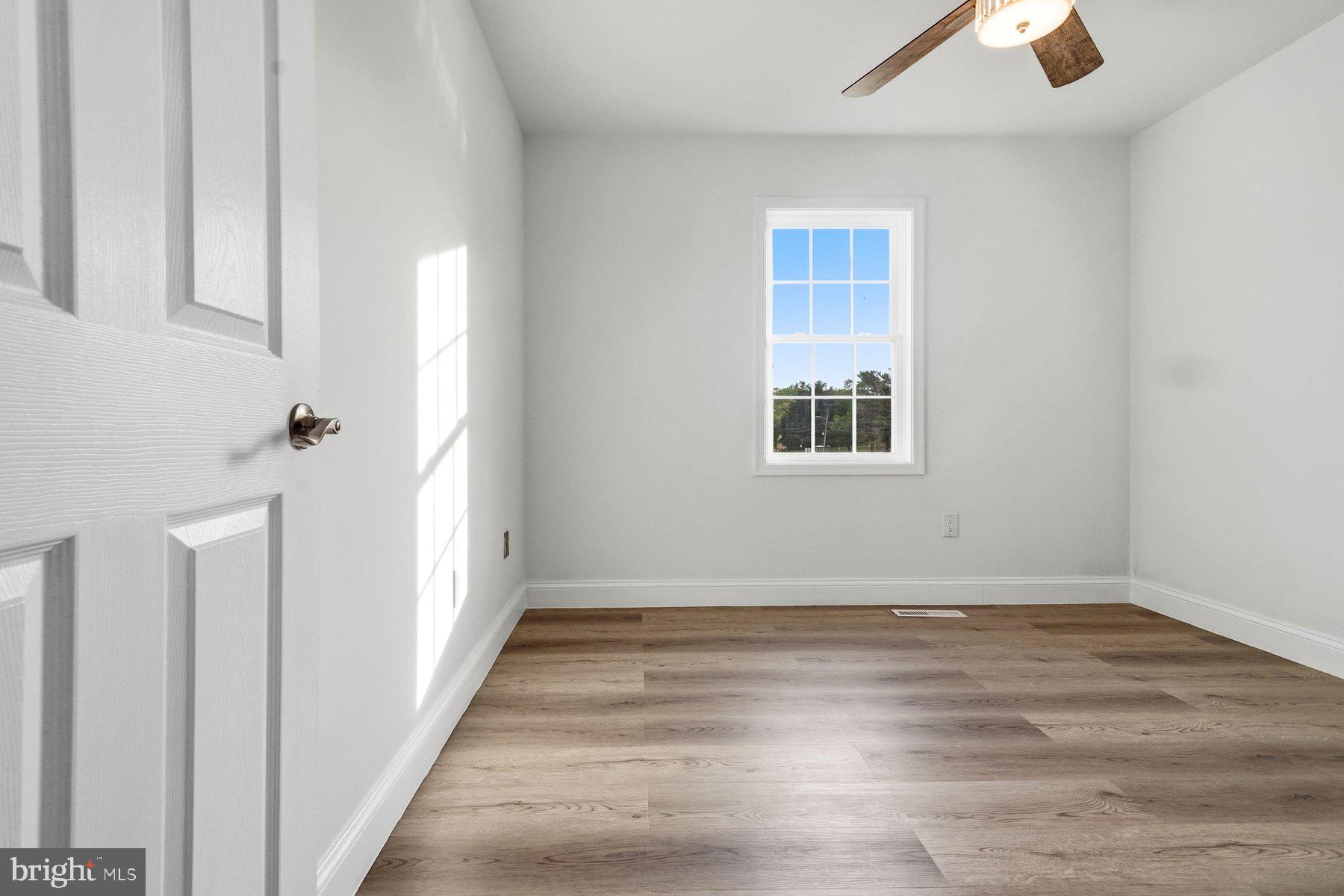 6301 Linus Drive Baltimore, MD 21207 - Photo 24 of 38 a view of a room with wooden floor and window