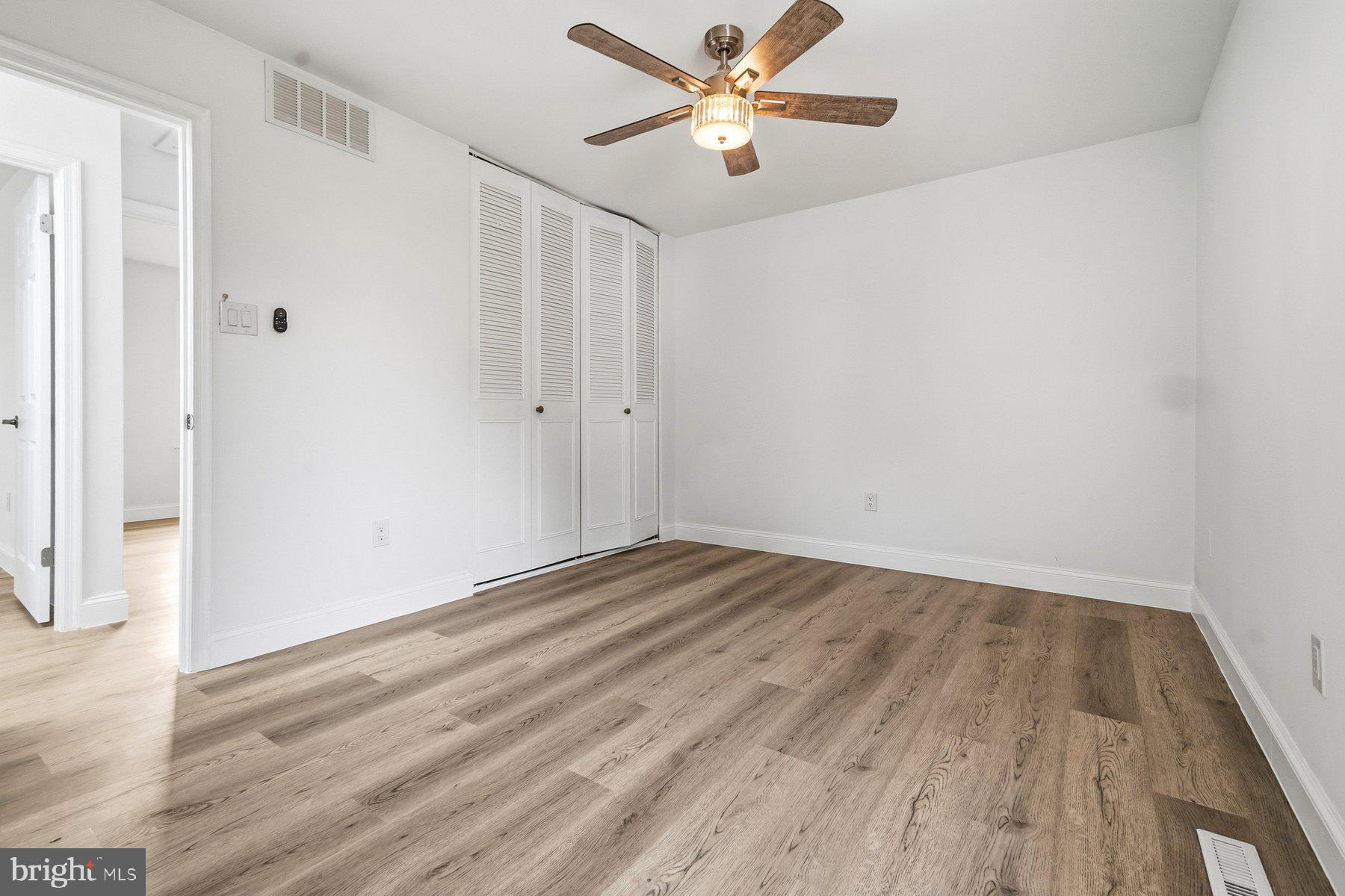 6301 Linus Drive Baltimore, MD 21207 - Photo 28 of 38 a view of empty room with wooden floor