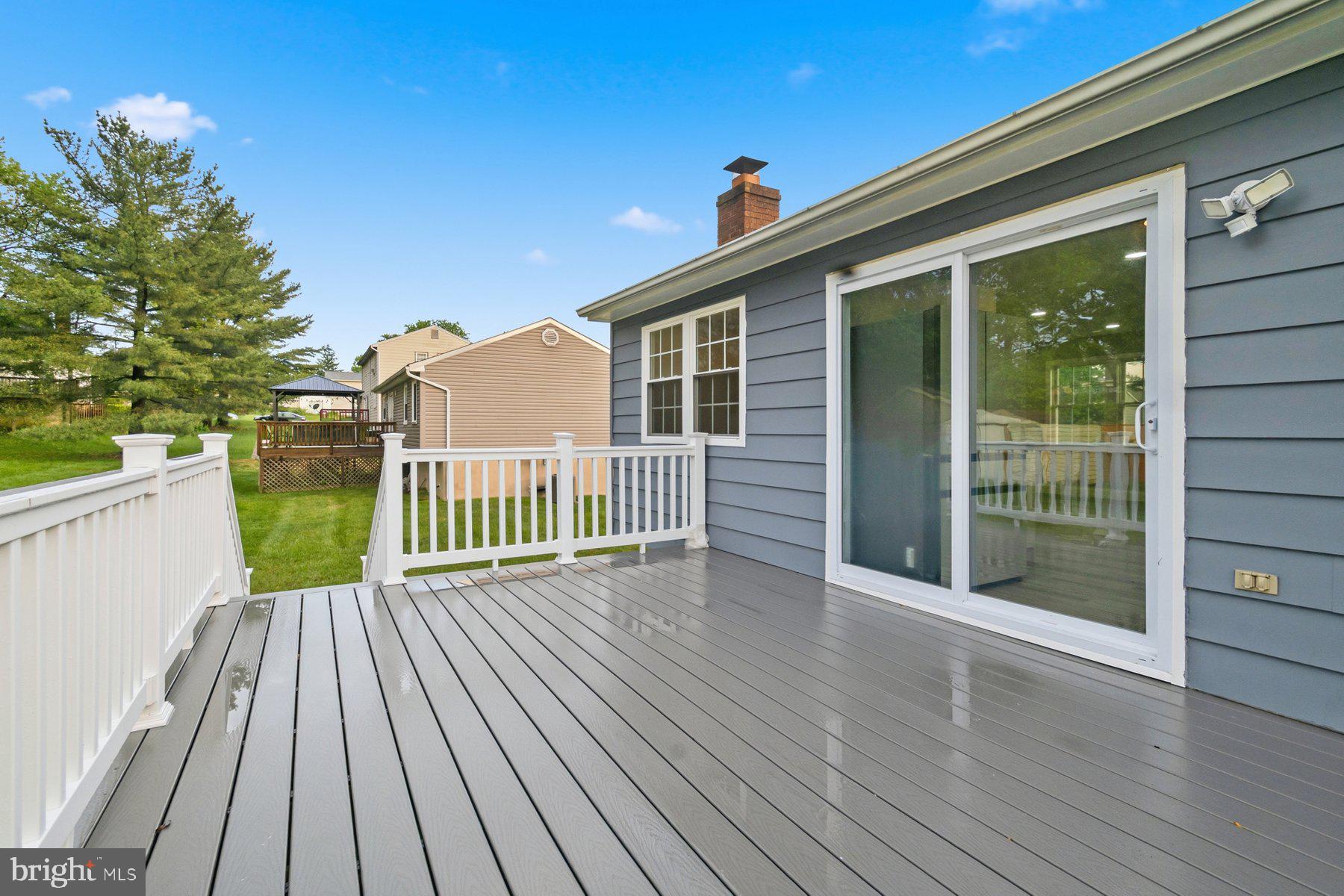 6301 Linus Drive Baltimore, MD 21207 - Photo 7 of 38 a view of a deck with wooden floor and fence