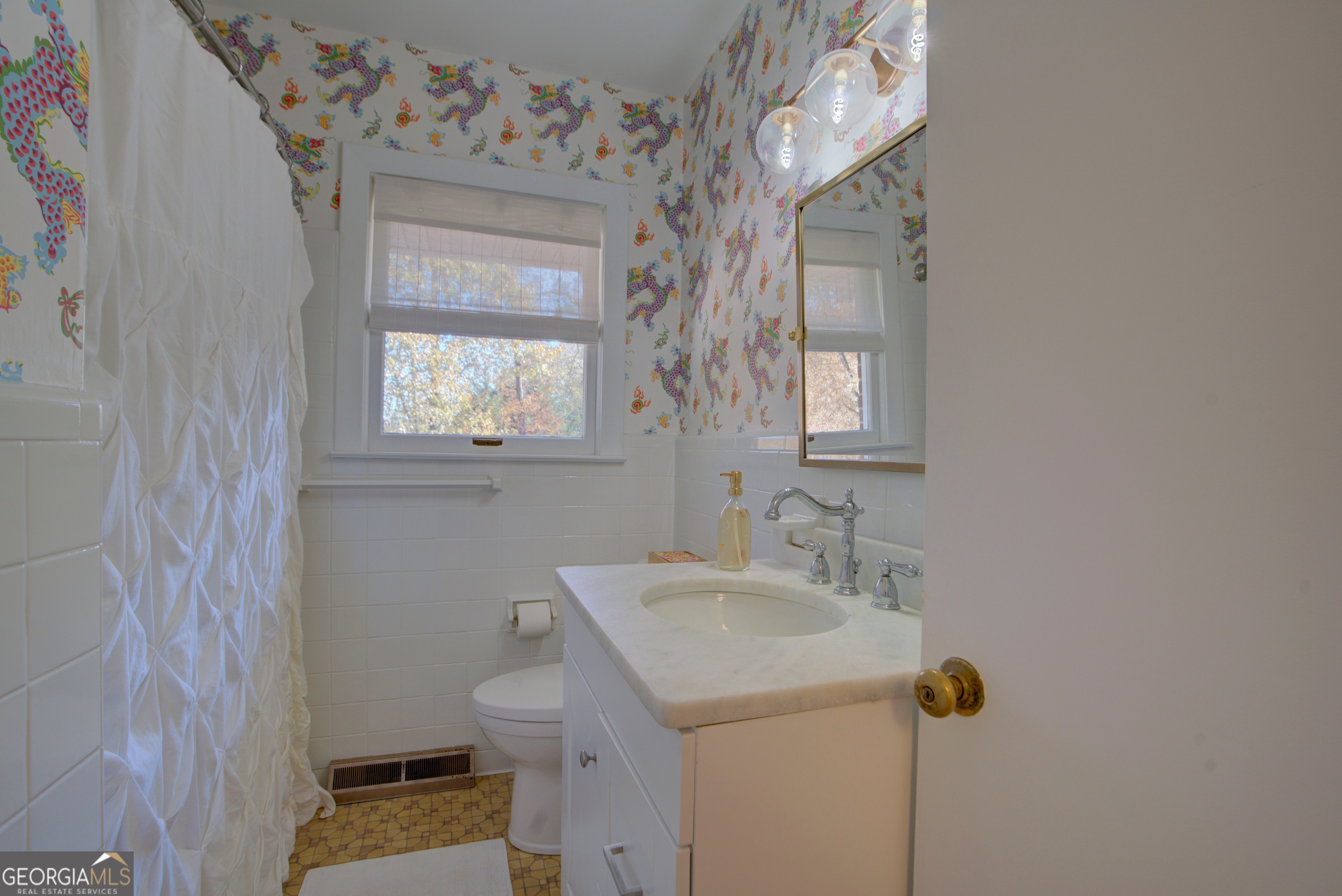 17 Crestwood Drive Rome, GA 30165 - Photo 27 of 36 a bathroom with a sink and mirror with toilet