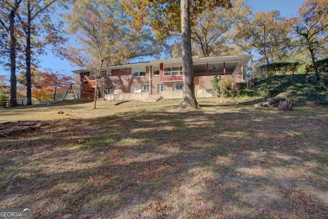 a view of road with large trees