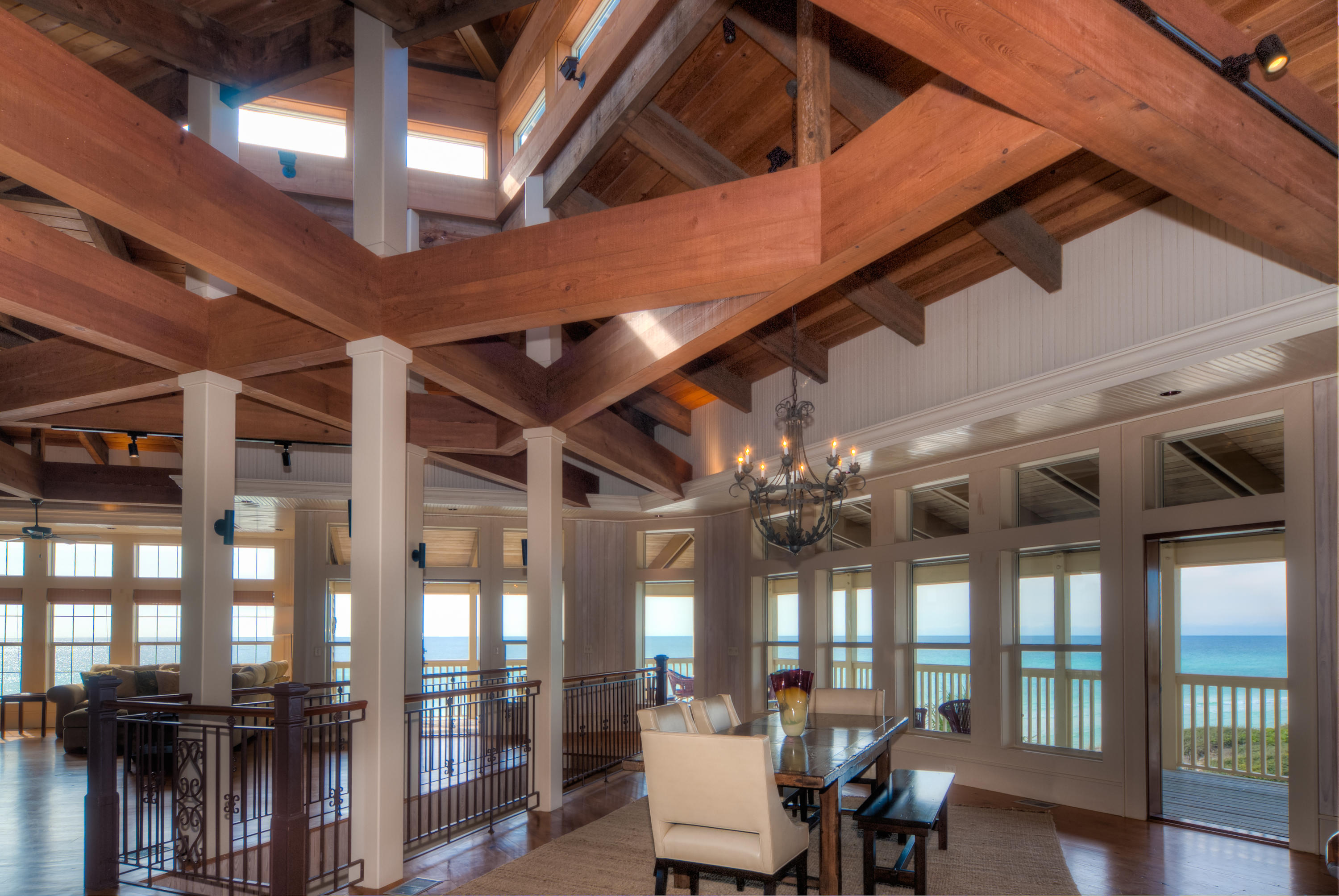491 Old Beach Road Santa Rosa Beach, FL 32459 - Photo 2 of 36 a view of a dining room with furniture wooden floor and chandelier