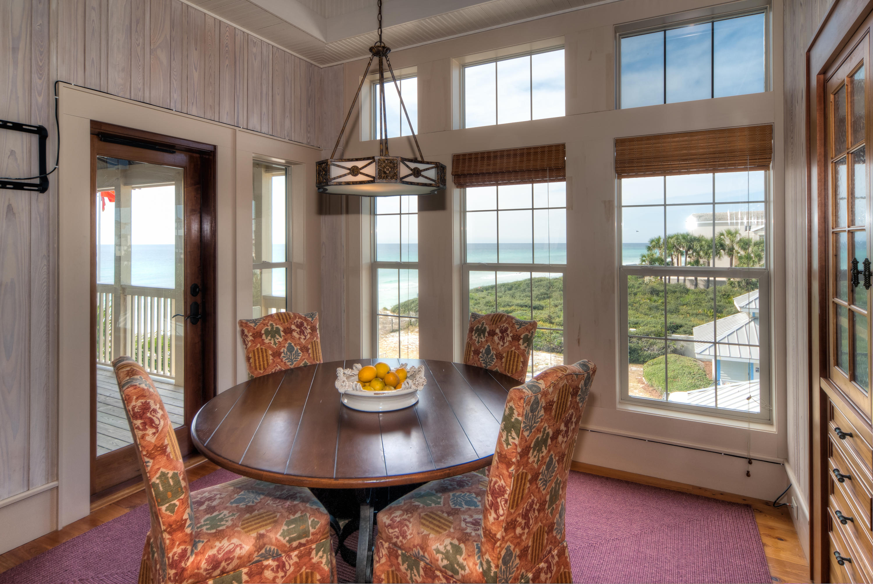 491 Old Beach Road Santa Rosa Beach, FL 32459 - Photo 17 of 36 a view of a dining room with furniture and wooden floor