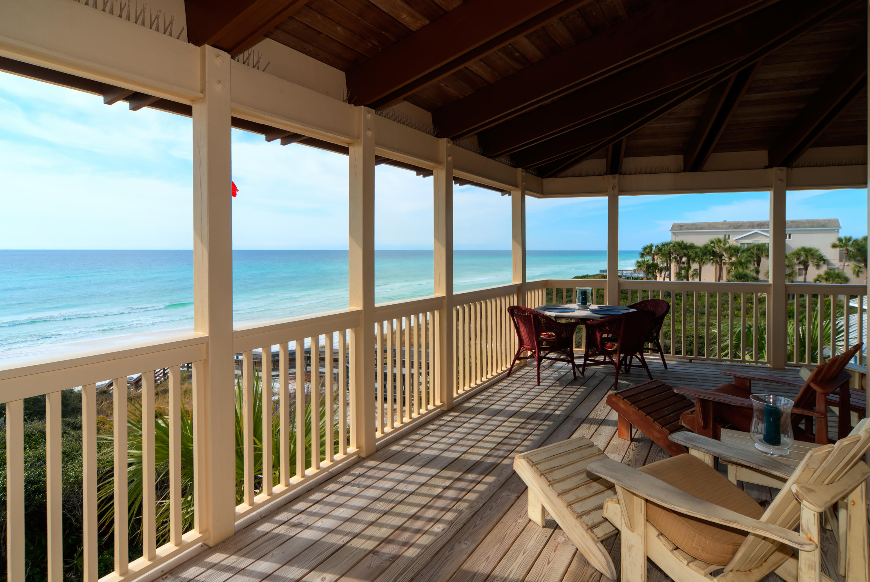 491 Old Beach Road Santa Rosa Beach, FL 32459 - Photo 19 of 36 a view of a balcony with chairs and wooden floor