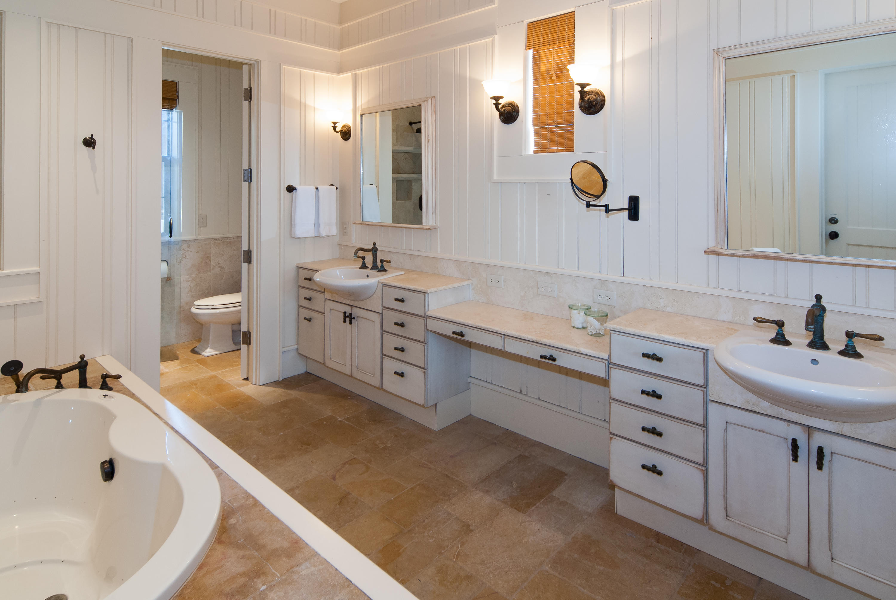 491 Old Beach Road Santa Rosa Beach, FL 32459 - Photo 29 of 36 a bathroom with a tub sink and mirror