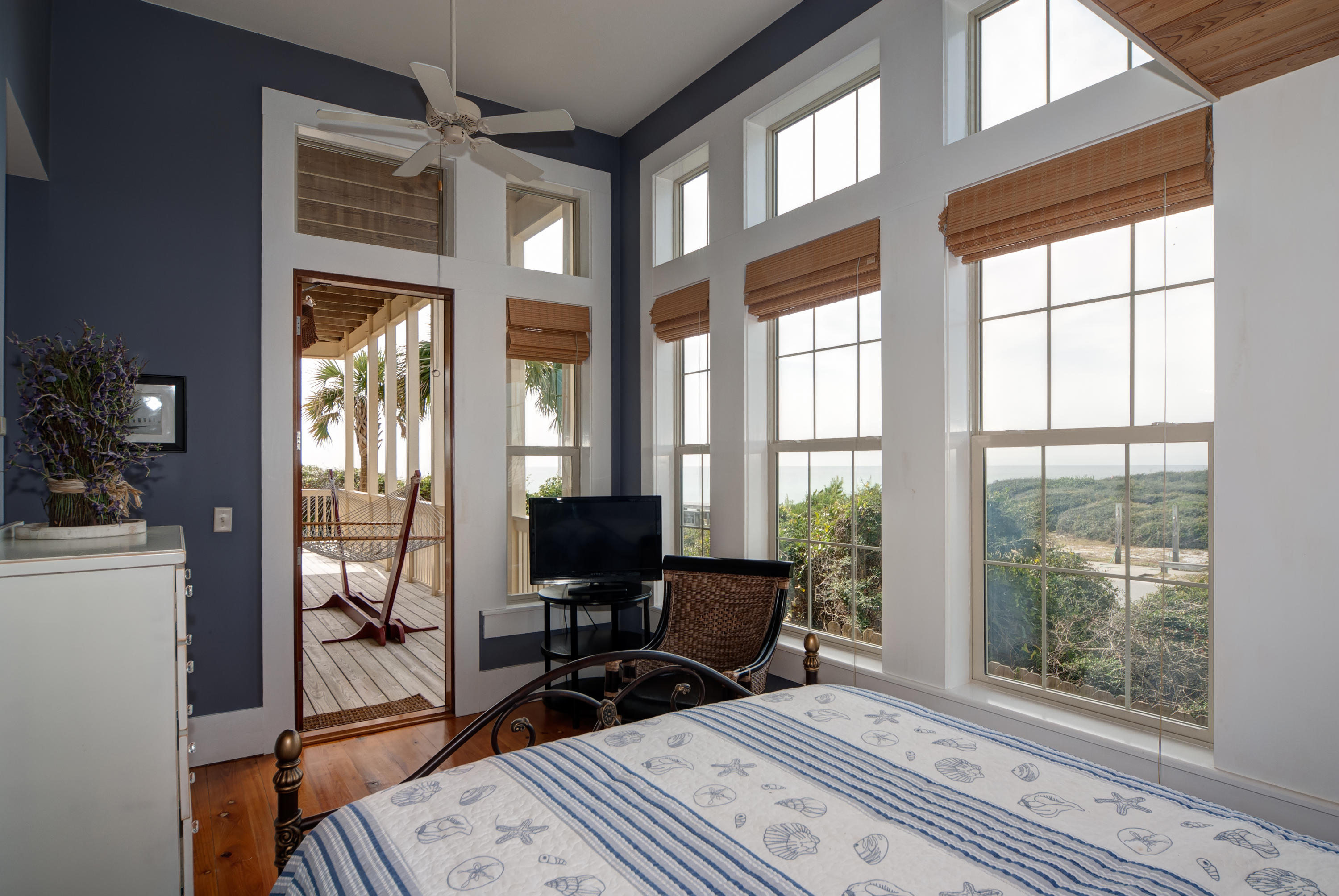 491 Old Beach Road Santa Rosa Beach, FL 32459 - Photo 31 of 36 a bedroom with furniture and large windows