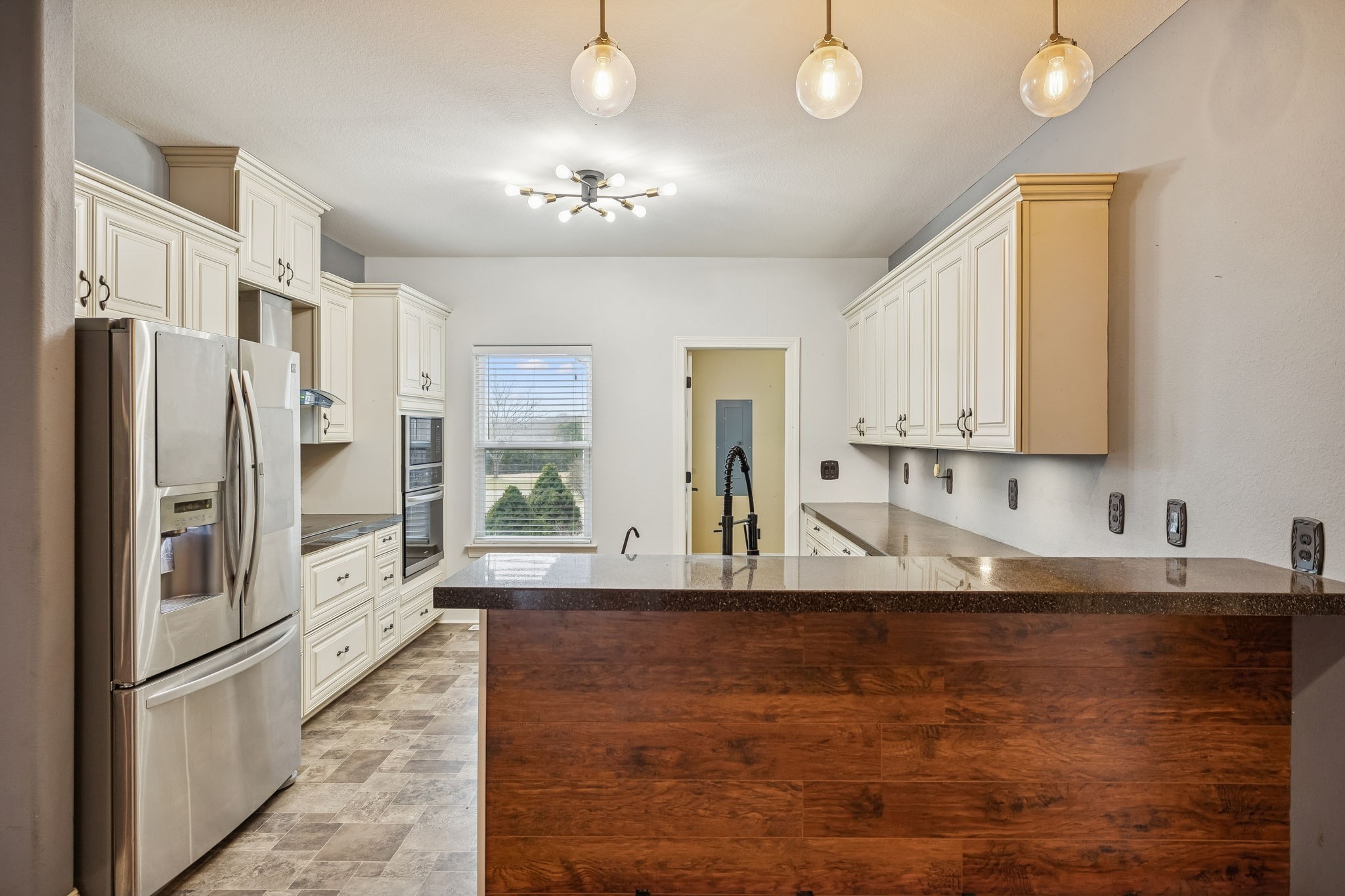 1970 Corinth Road Mount Juliet, TN 37122 - Photo 16 of 71 a kitchen with stainless steel appliances granite countertop a refrigerator and a sink