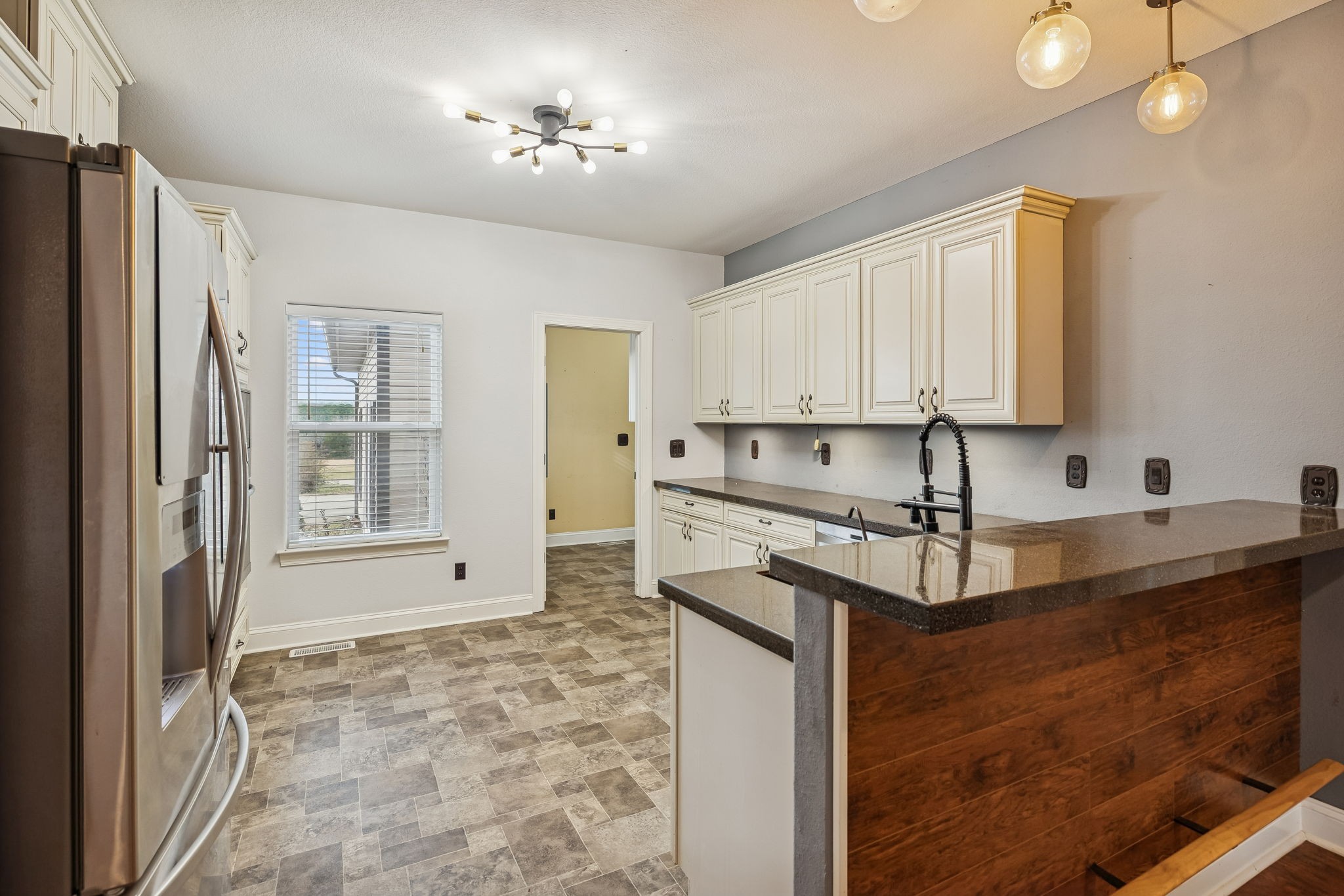 1970 Corinth Road Mount Juliet, TN 37122 - Photo 17 of 71 a kitchen with stainless steel appliances granite countertop a sink stove and refrigerator