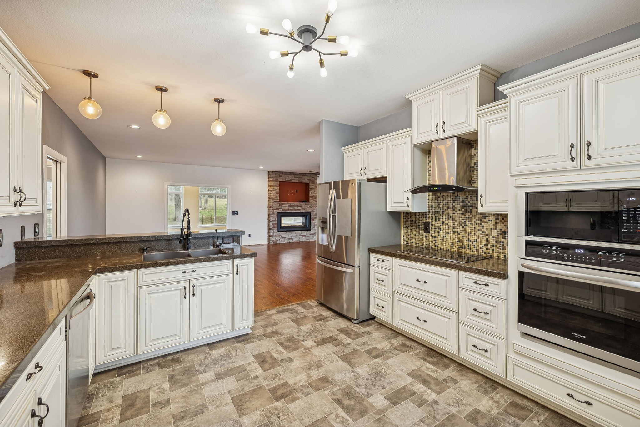 1970 Corinth Road Mount Juliet, TN 37122 - Photo 19 of 71 a large kitchen with stainless steel appliances granite countertop a stove sink and cabinets