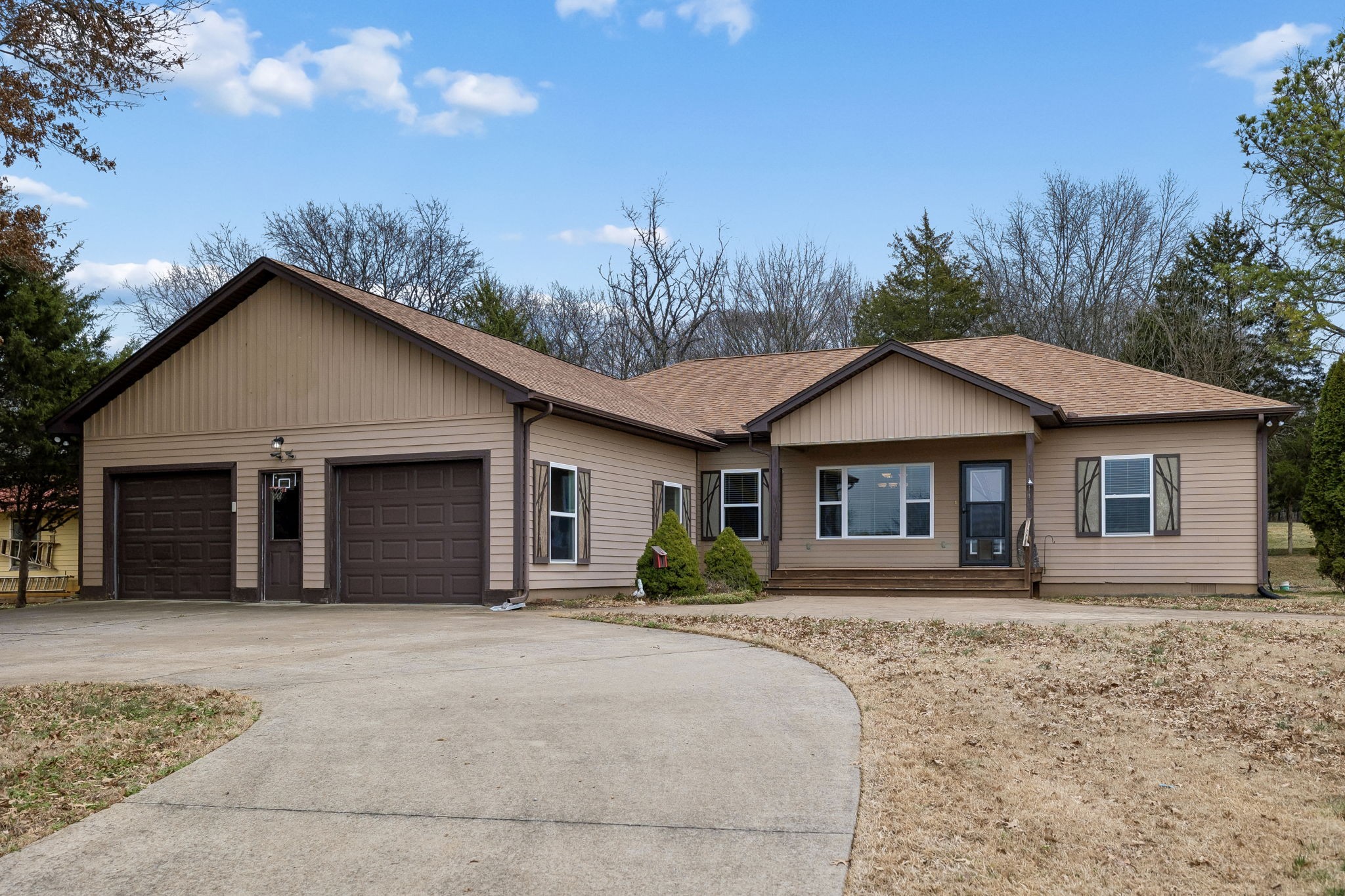 1970 Corinth Road Mount Juliet, TN 37122 - Photo 2 of 71 a front view of a house with a yard and garage