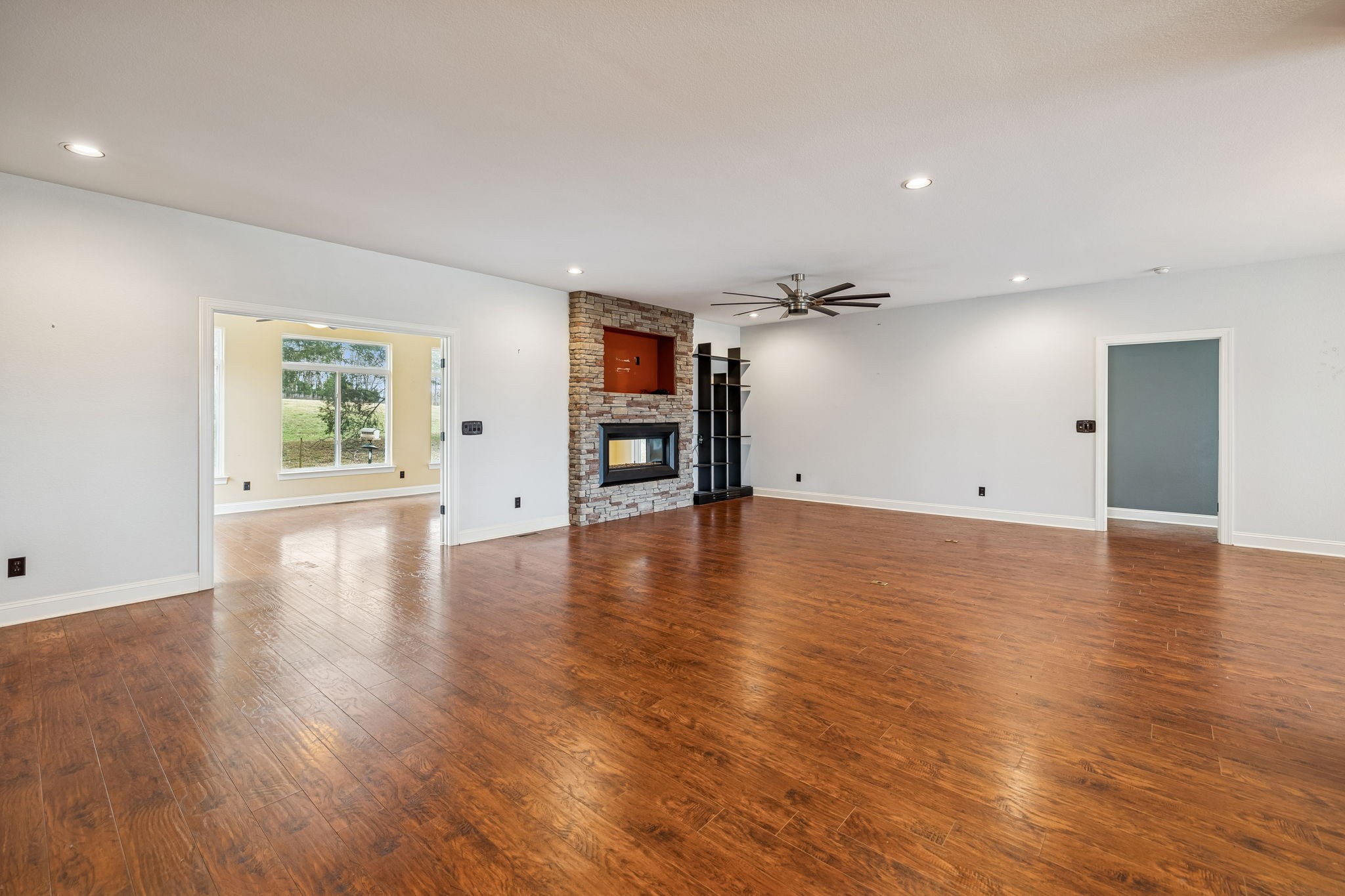 1970 Corinth Road Mount Juliet, TN 37122 - Photo 30 of 71 an empty room with wooden floor fireplace and windows